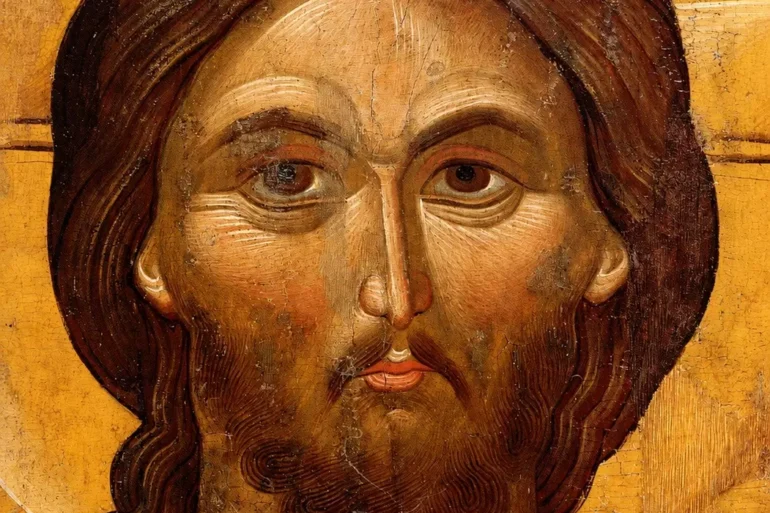 Détail Du Visage Du Christ Avec La Chevelure Ondulée Tombant Sur L'Épaule Droite, Les Pommettes Saillantes Et L'Expression Grave