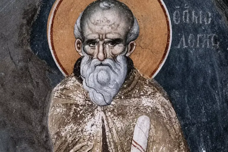 Close-Up Of The Manuel Panselinos Saint Maximus Fresco, Displaying The Aged Saint'S Lined Face And White Beard Against A Dark Background.