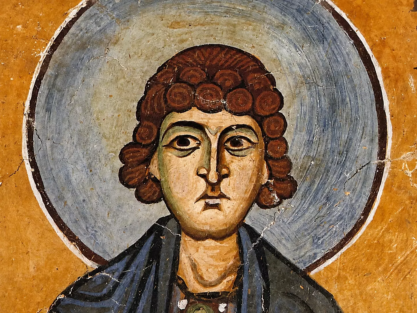 Close-Up Of The Saint Niketas Fresco At Hosios Loukas Revealing The Stylized Spiral Hair And Distinct Facial Modeling.